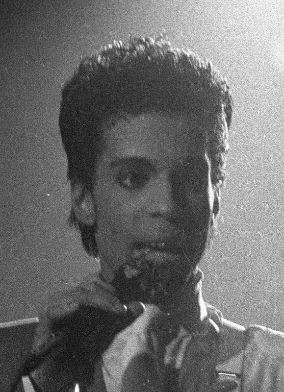 Prince performing on stage at Forest National in Brussels in 1986